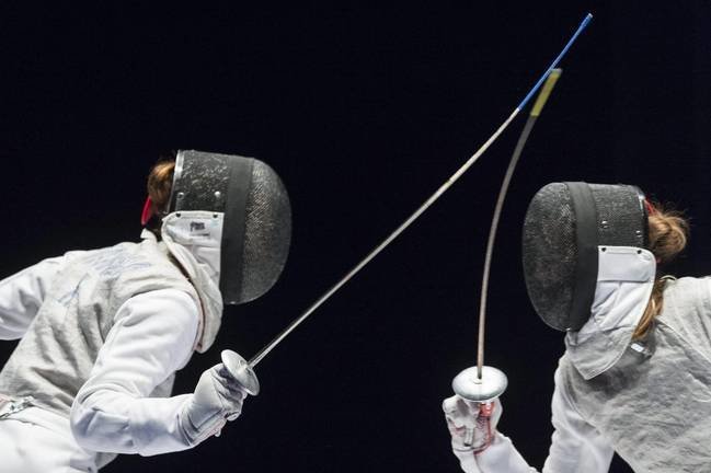 epa04790164 A photograph made available on 09 June 2015 showing Elisa Di Francisca, of Italy, (L), competes against Larisa Korobeynikova, of Russia, (R), during women's foil final at the European Fencing Championships in Montreux, Switzerland, 08 June 2015.  EPA/DOMINIC STEINMANN