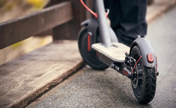 Use of scooter as a means of transportation on the street.