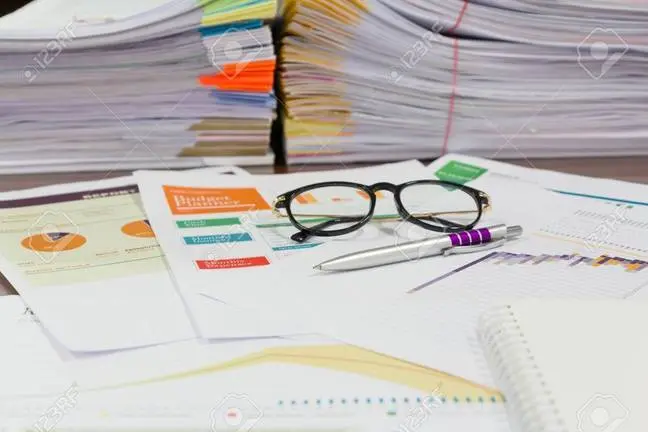 Analysis chart and paperwork on office table