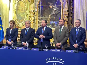 Toscano, en el centro, durante el encuentro