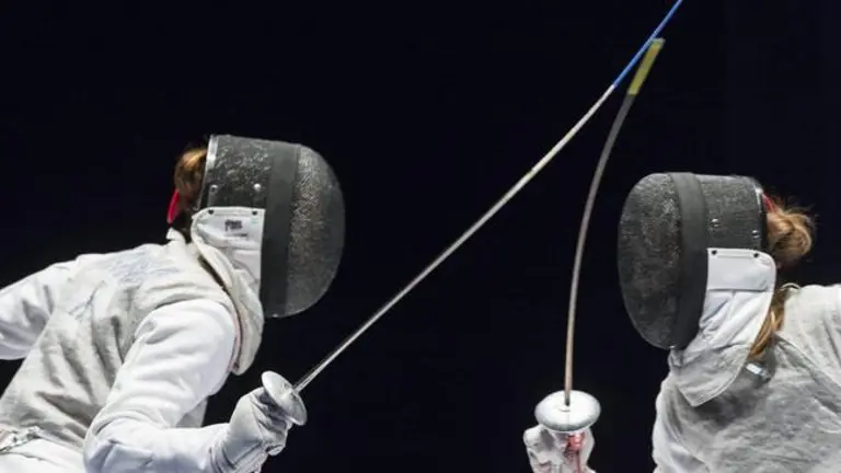 epa04790164 A photograph made available on 09 June 2015 showing Elisa Di Francisca, of Italy, (L), competes against Larisa Korobeynikova, of Russia, (R), during women's foil final at the European Fencing Championships in Montreux, Switzerland, 08 June 2015.  EPA/DOMINIC STEINMANN
