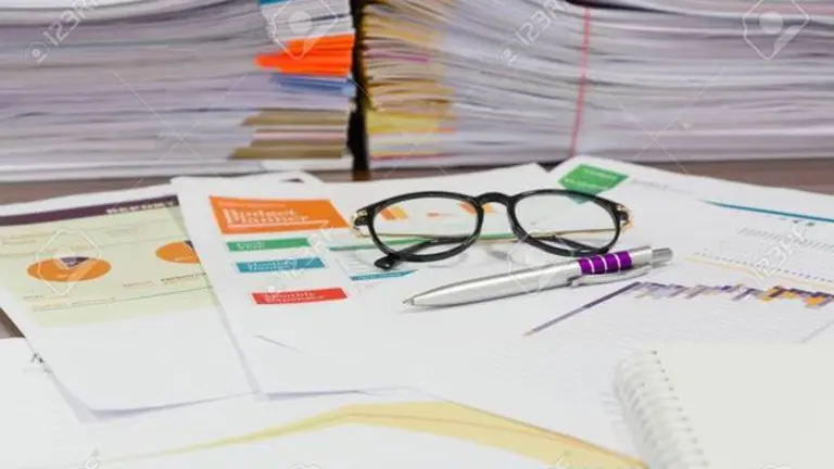 Analysis chart and paperwork on office table