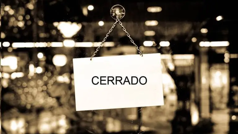 Sign with space for text hanging in a shop window