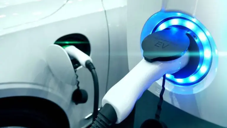 Power supply connect to electric vehicle for charge to the battery. Charging technology industry transport which are the futuristic of the Automobile. EV fuel Plug in hybrid car.