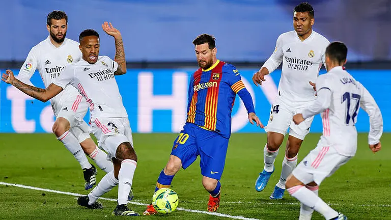 Lionel Messi of FC Barcelona and players of Real Madrid during the La Liga match between Real Madrid and FC Barcelona played at Alfredo Di Stefano Stadium on April 10, 2021 in Madrid, Spain. (Photo by Ruben Albarran / Pressinphoto / Icon Sport)  By Icon Sport   - Photo by Icon Sport